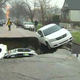 Illustration for article titled Chicago Sinkhole Swallows Three Cars